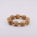 Bracciale elastico con perle in resina beige o ambra chiara